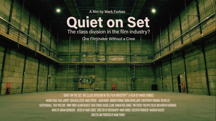 poster of a documentary by filmmaker Mark Forbes called Quiet on Set: The Class Division in the Film Industry? The image is of a larhe empty film set.